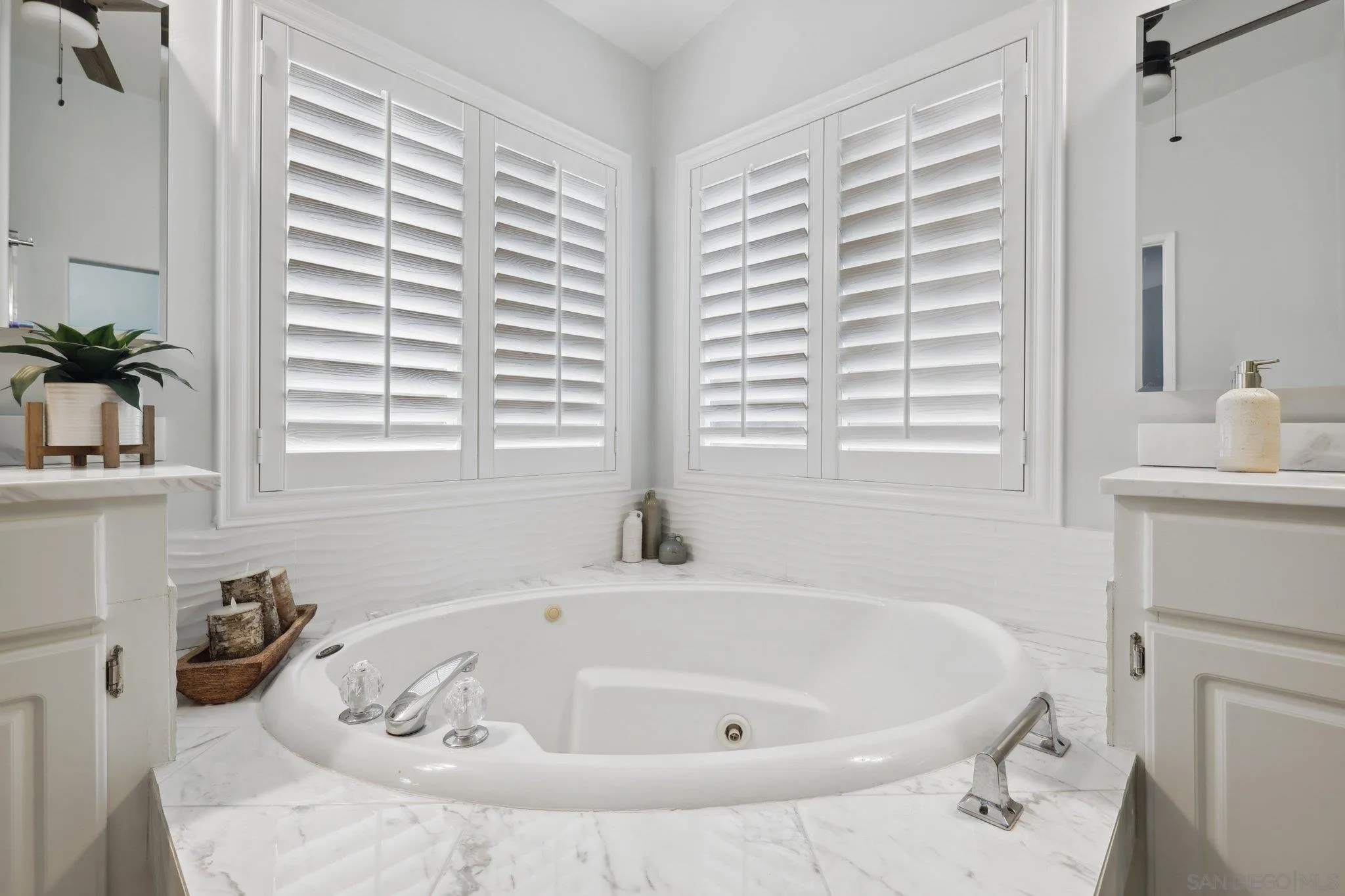 7002 San Bartolo Street, Unit 30 Carlsbad, CA 92011 - Photo 21 of 59 a bath tub sitting in a bathroom next to a window