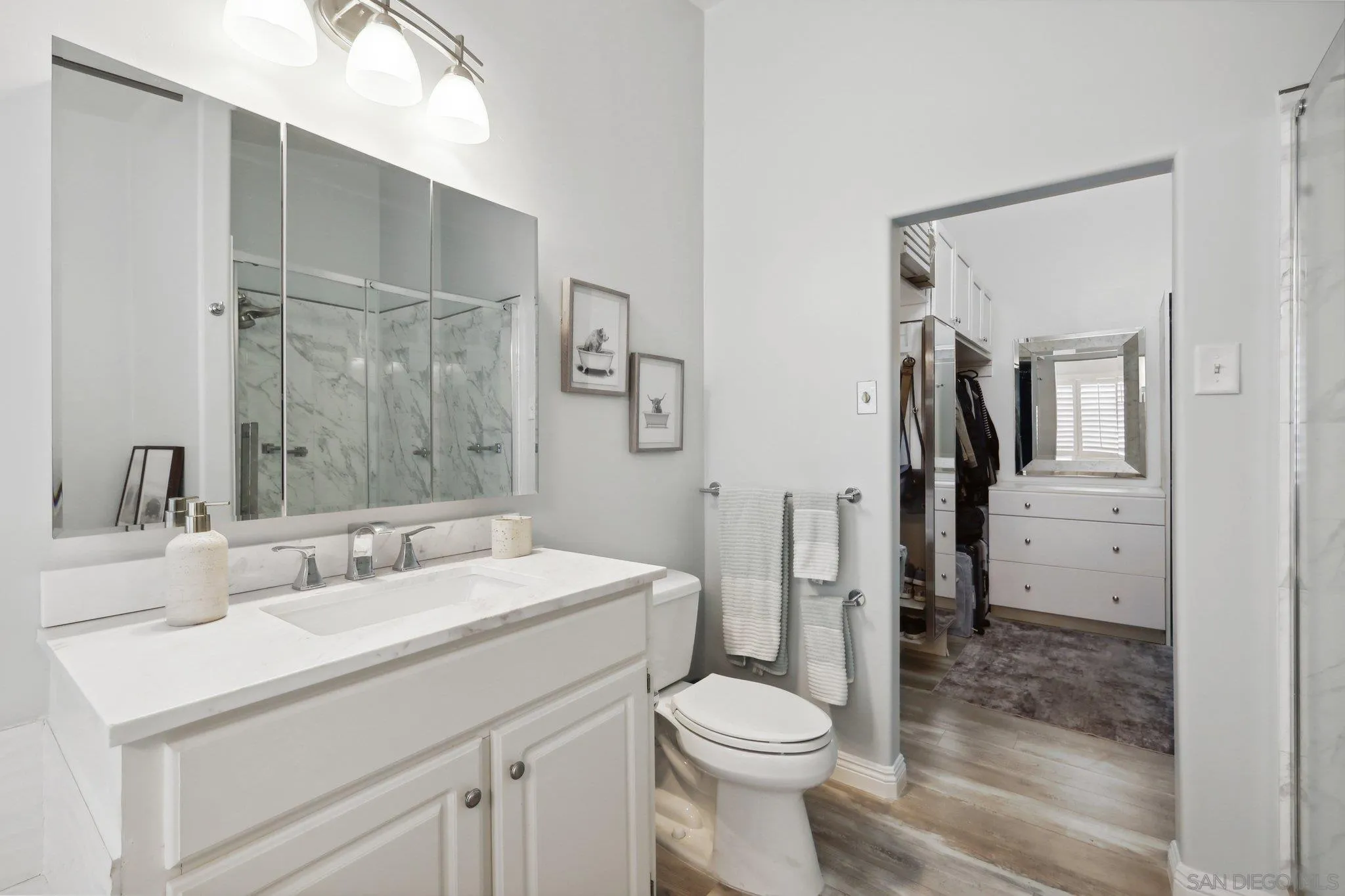 7002 San Bartolo Street, Unit 30 Carlsbad, CA 92011 - Photo 22 of 59 a bathroom with a sink a toilet and shower