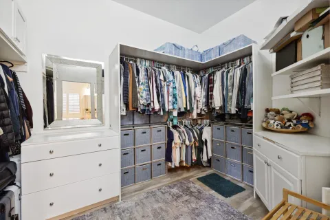 a bathroom with a sink a light fixture and a mirror