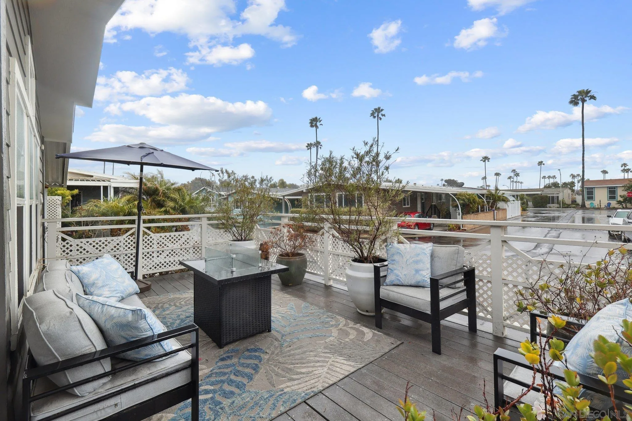 7002 San Bartolo Street, Unit 30 Carlsbad, CA 92011 - Photo 32 of 59 a view of a terrace with seating area