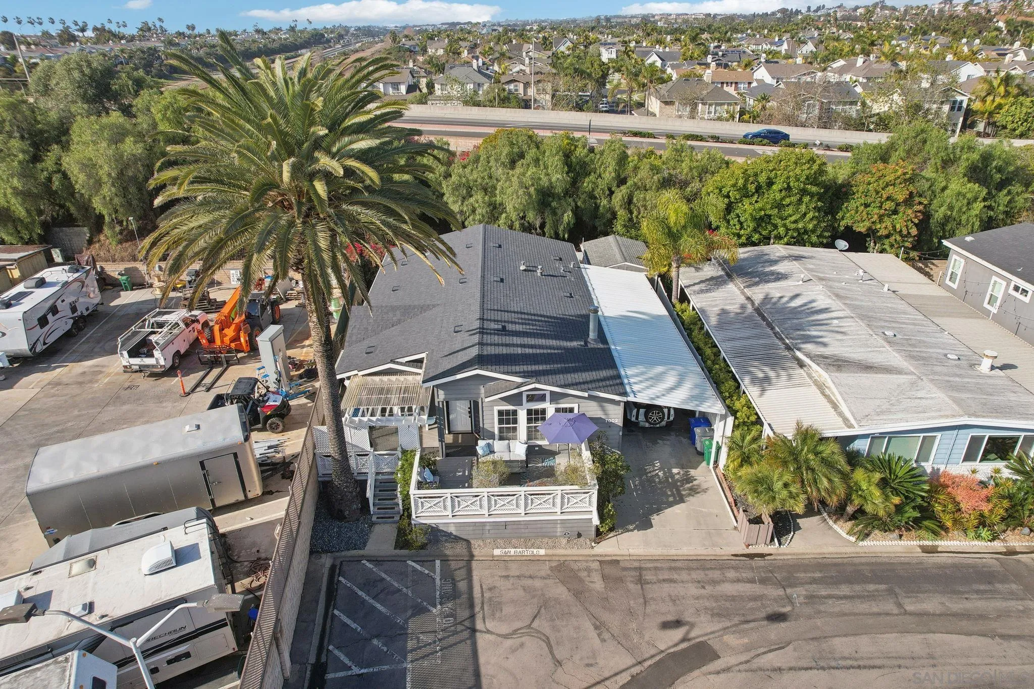 7002 San Bartolo Street, Unit 30 Carlsbad, CA 92011 - Photo 38 of 59 an aerial view of multiple houses with a yard