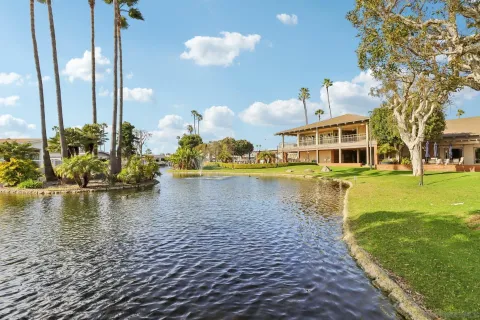 a view of a swimming pool with a table and chairs