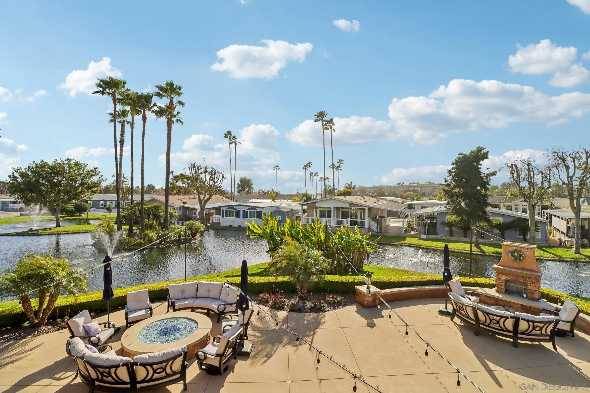7002 San Bartolo Street, Unit 30 Carlsbad, CA 92011 - Photo 43 of 59 a view of a lake with couches table and chairs