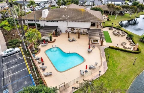 a living room with furniture and a book shelf