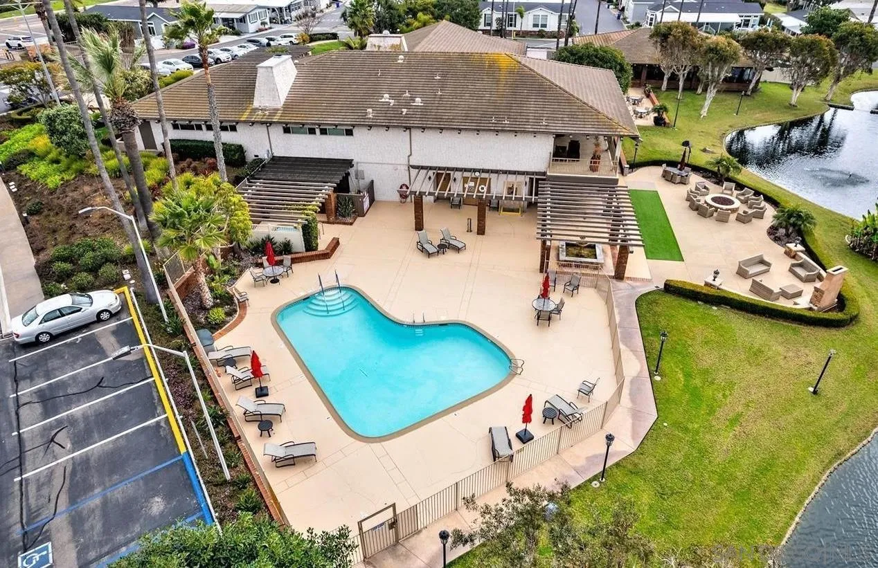 7002 San Bartolo Street, Unit 30 Carlsbad, CA 92011 - Photo 47 of 59 an aerial view of a house with swimming pool and large trees