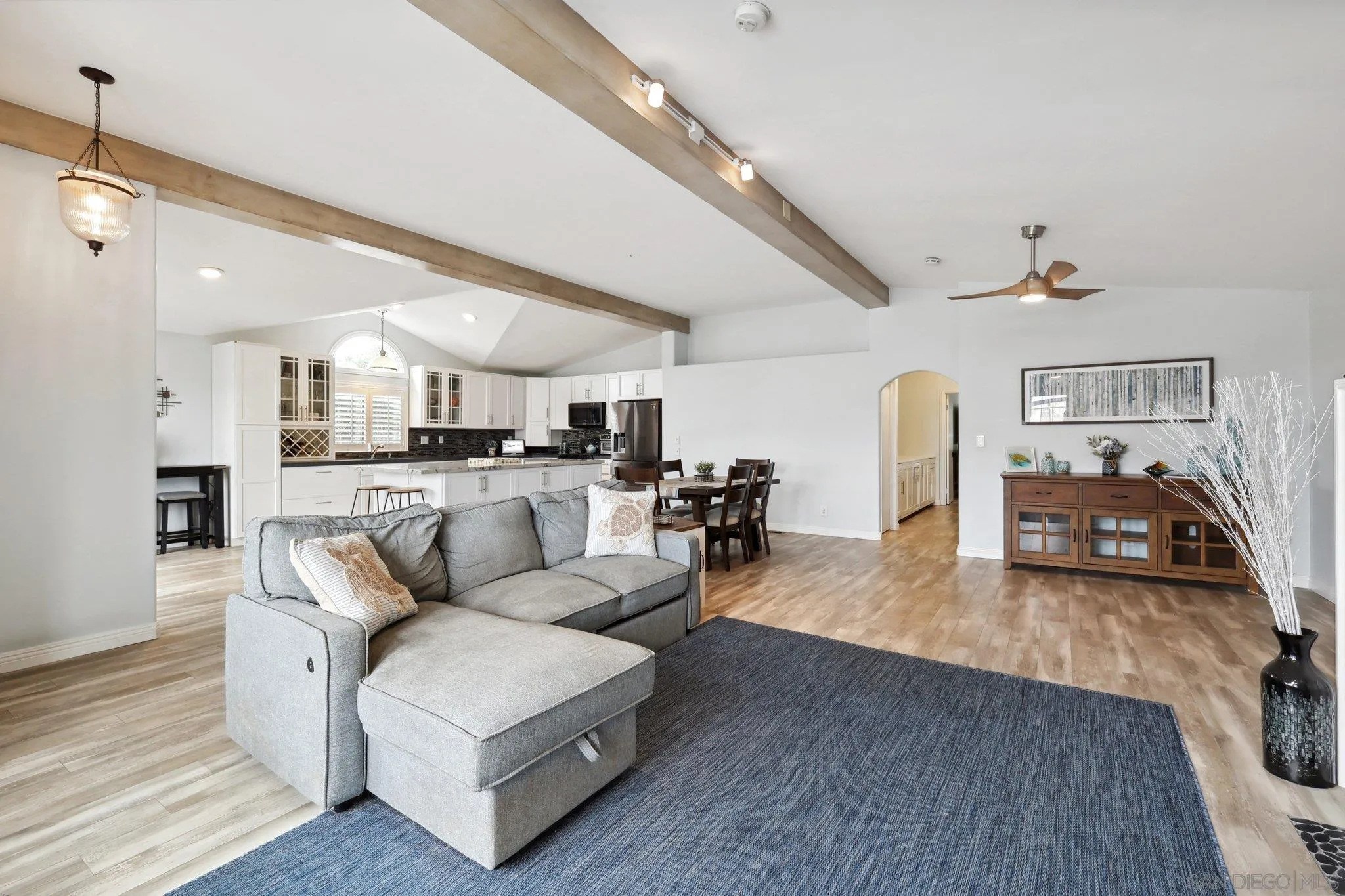7002 San Bartolo Street, Unit 30 Carlsbad, CA 92011 - Photo 5 of 59 a living room with furniture and kitchen view