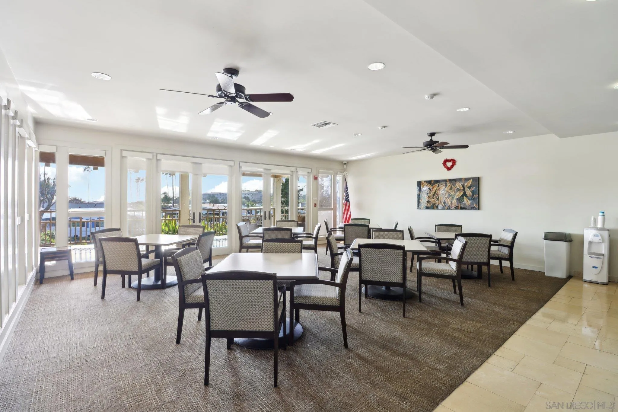 7002 San Bartolo Street, Unit 30 Carlsbad, CA 92011 - Photo 51 of 59 a living room with lots of furniture and a large window