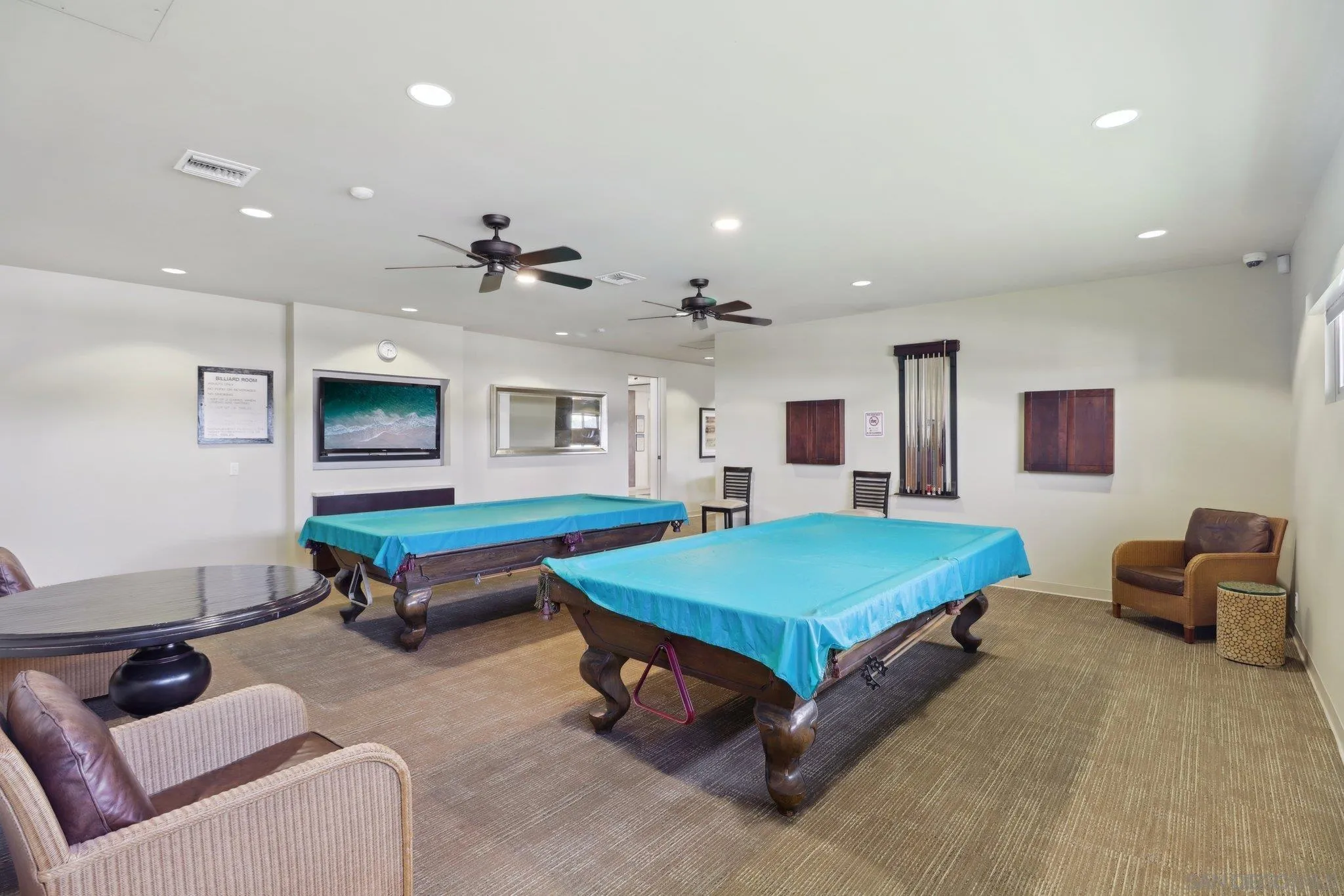 7002 San Bartolo Street, Unit 30 Carlsbad, CA 92011 - Photo 54 of 59 a living room with furniture and a table