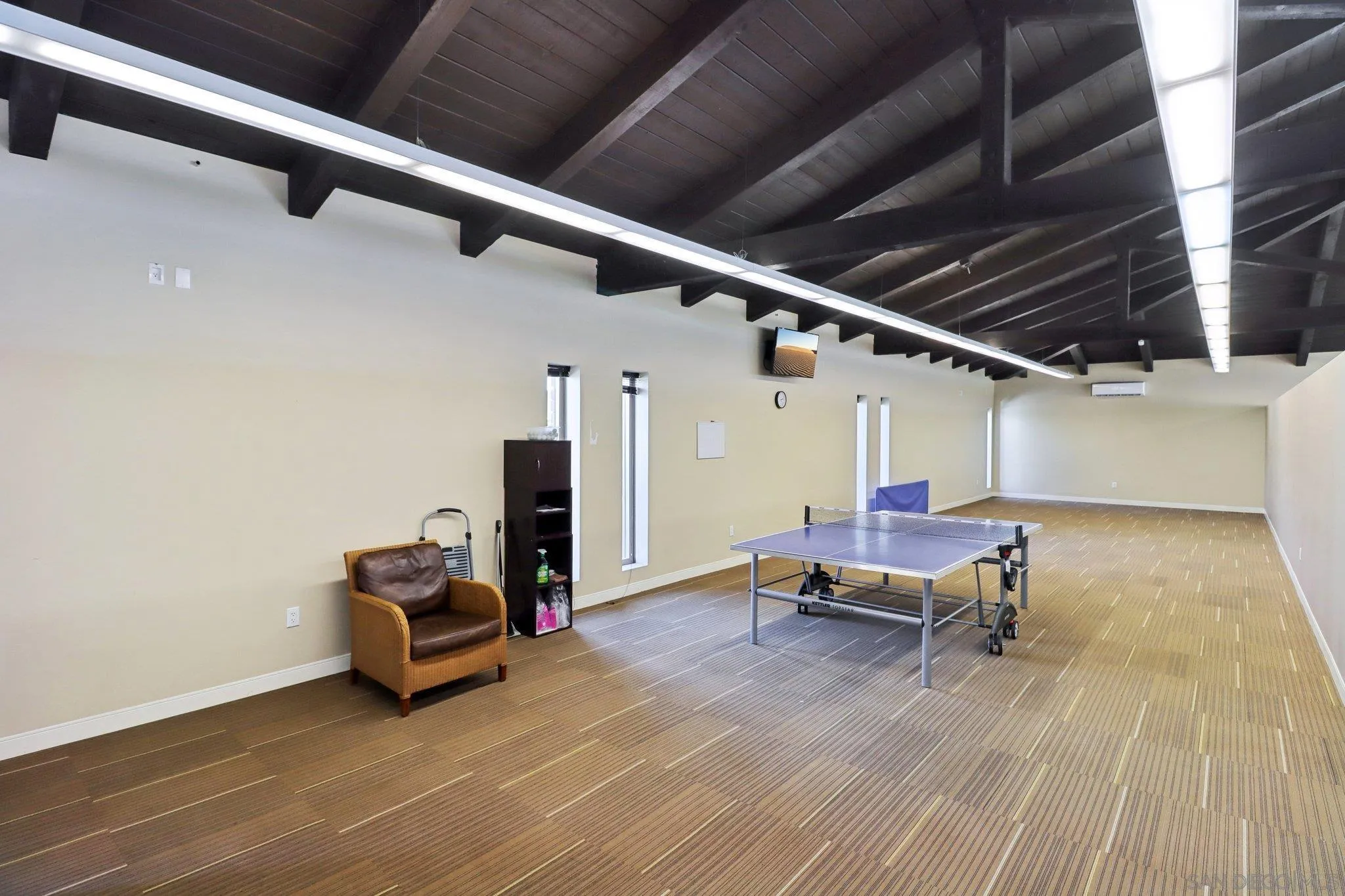 7002 San Bartolo Street, Unit 30 Carlsbad, CA 92011 - Photo 55 of 59 a living room with furniture and a wooden floor