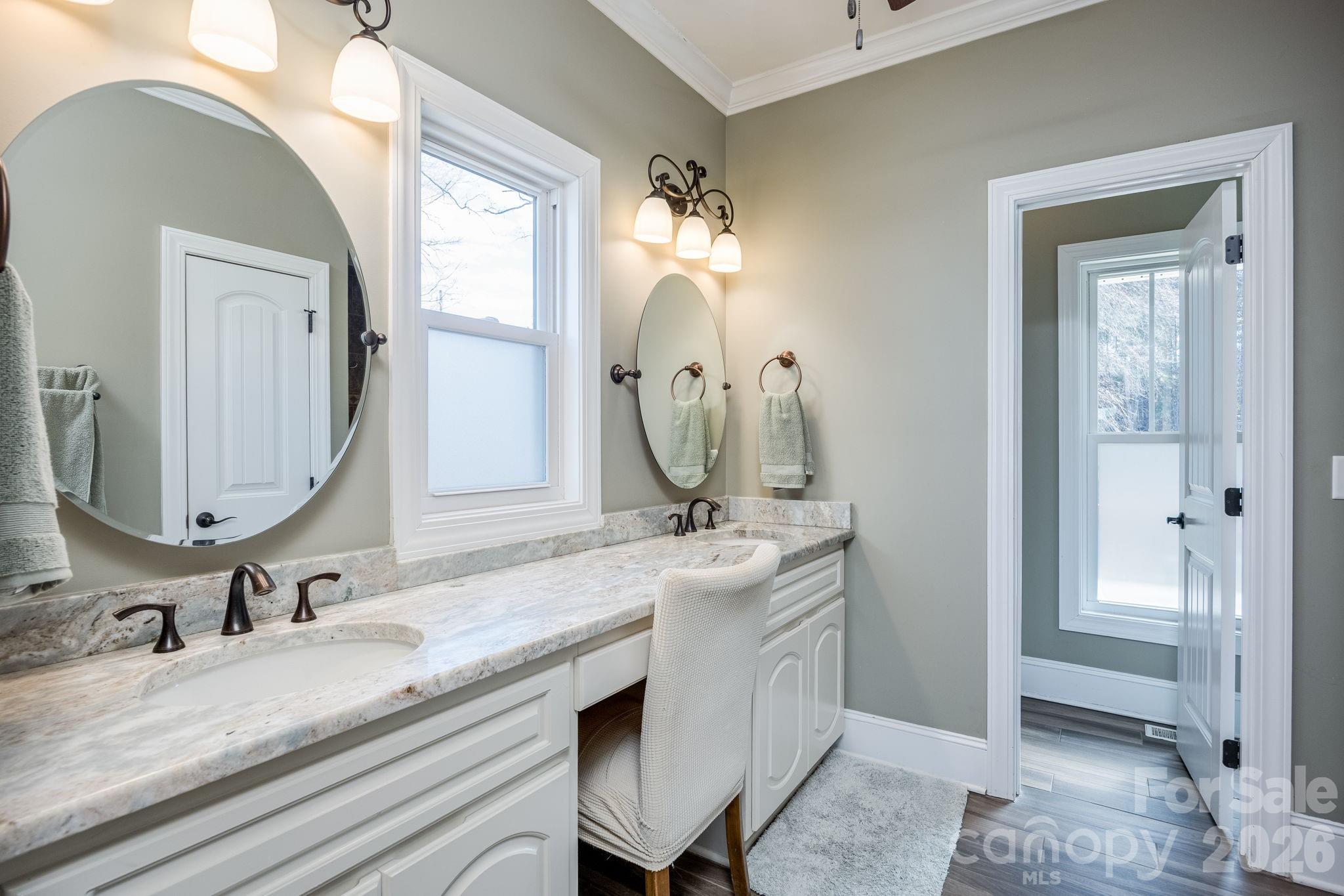 2583 Rockbridge Road Ridgeway, SC 29130 - Photo 23 of 48 a bathroom with a double vanity sink mirror and next to a window