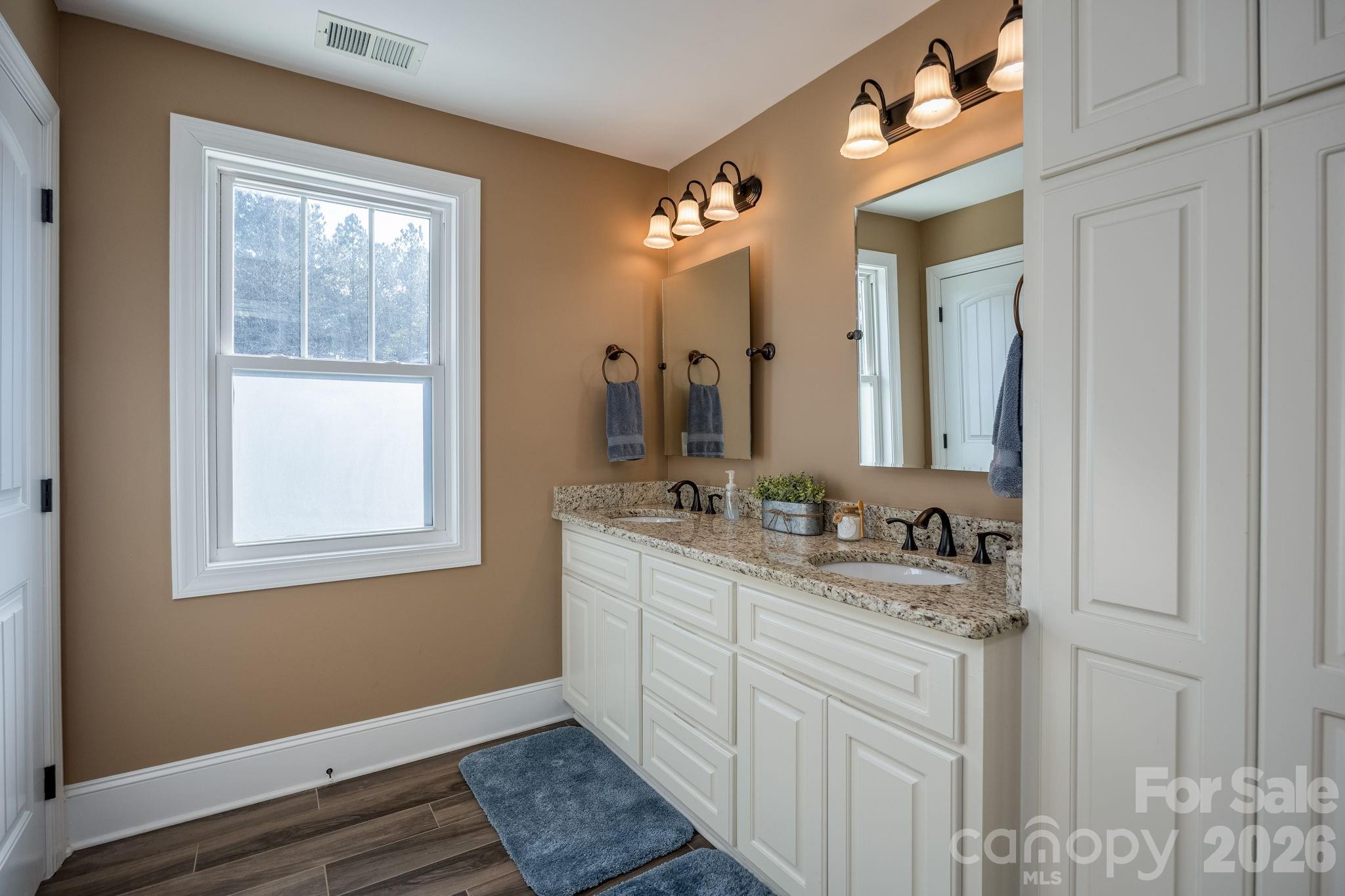 2583 Rockbridge Road Ridgeway, SC 29130 - Photo 27 of 48 a bathroom with a double vanity sink and a mirror
