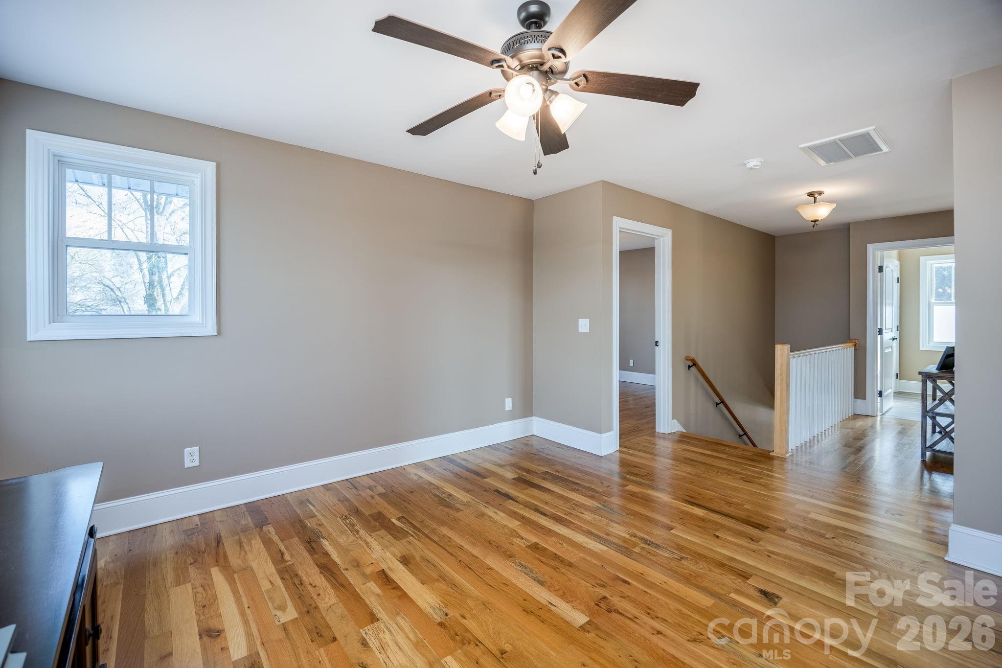 2583 Rockbridge Road Ridgeway, SC 29130 - Photo 28 of 48 a view of an empty room with window and wooden floor