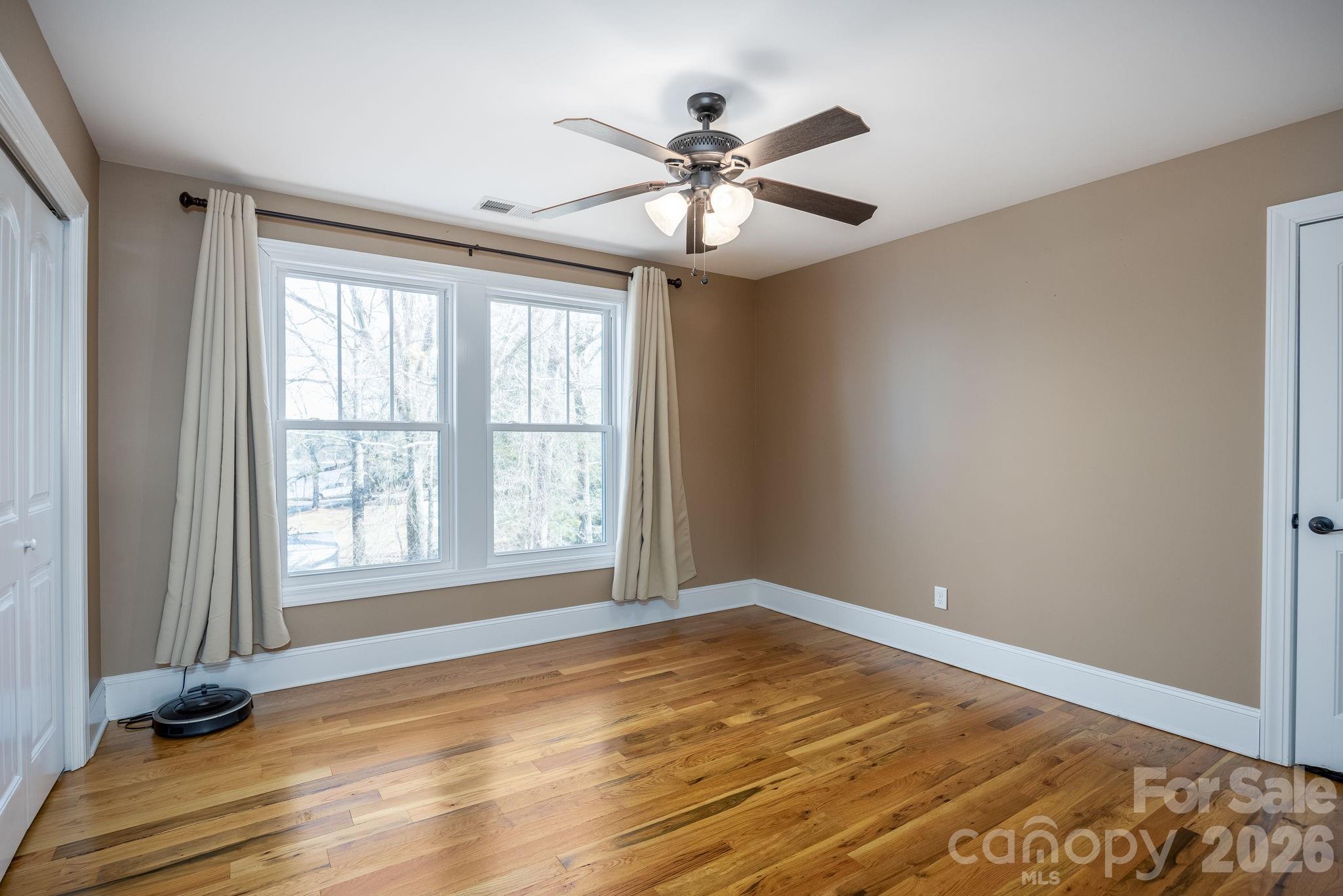 2583 Rockbridge Road Ridgeway, SC 29130 - Photo 29 of 48 a view of an empty room with wooden floor and a window