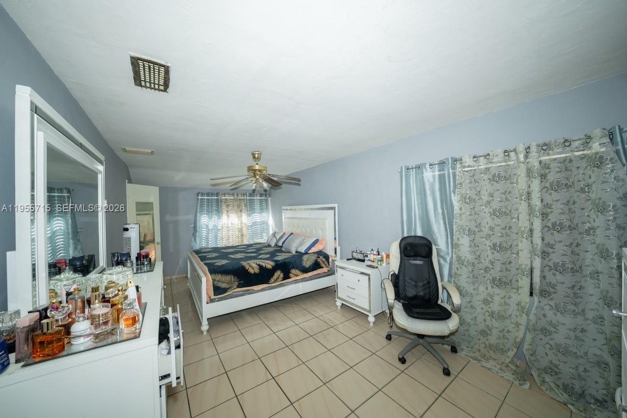 671 East 6th Place Hialeah, FL 33010 - Photo 15 of 40 a view of room with lounge chair