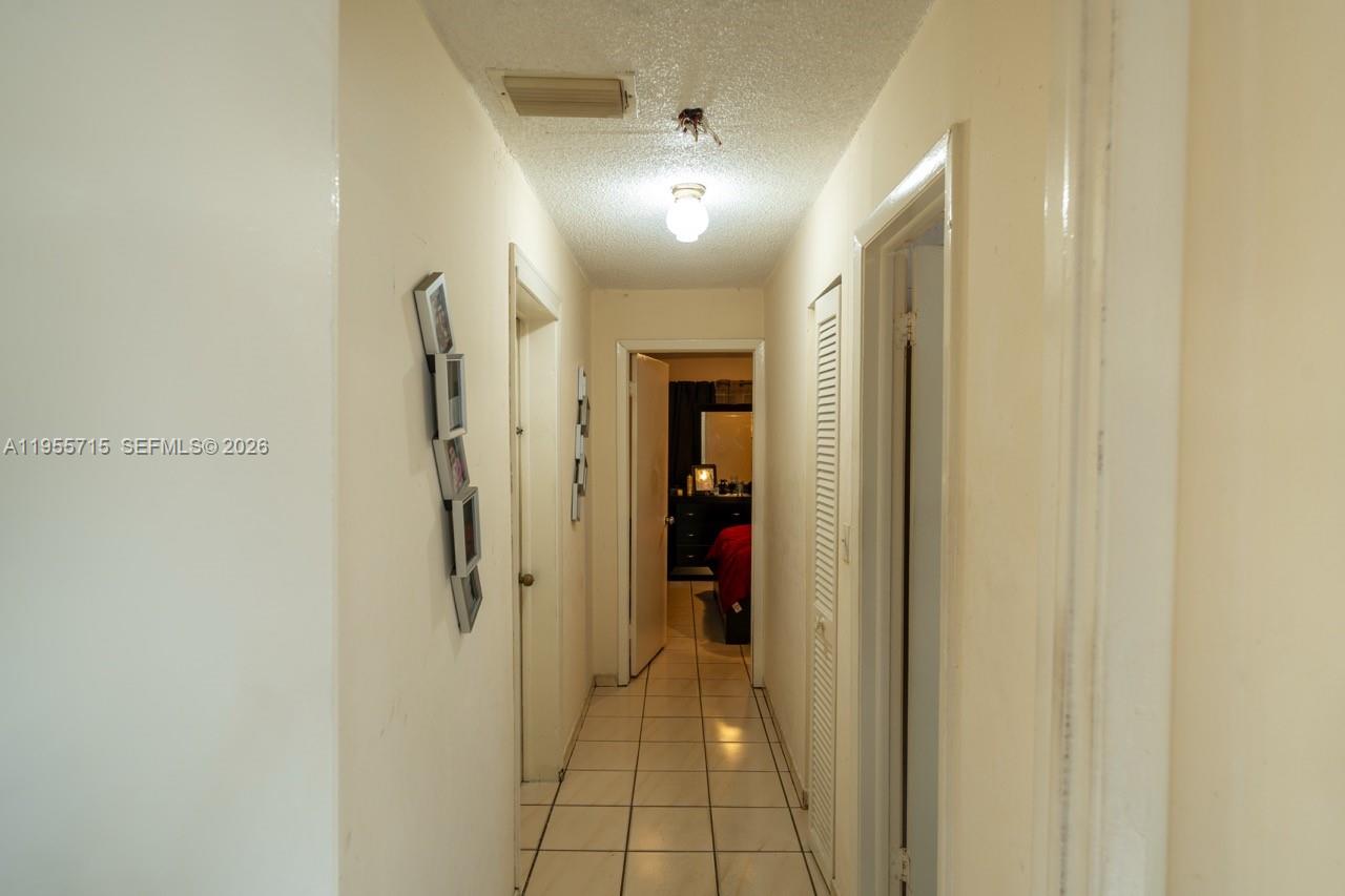 671 East 6th Place Hialeah, FL 33010 - Photo 23 of 40 a view of a hallway with a bathroom