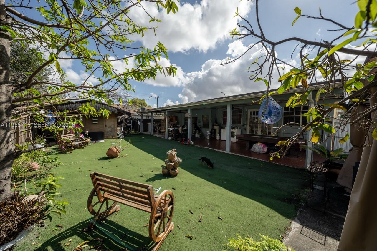 671 East 6th Place Hialeah, FL 33010 - Photo 31 of 40 a view of a backyard with sitting area