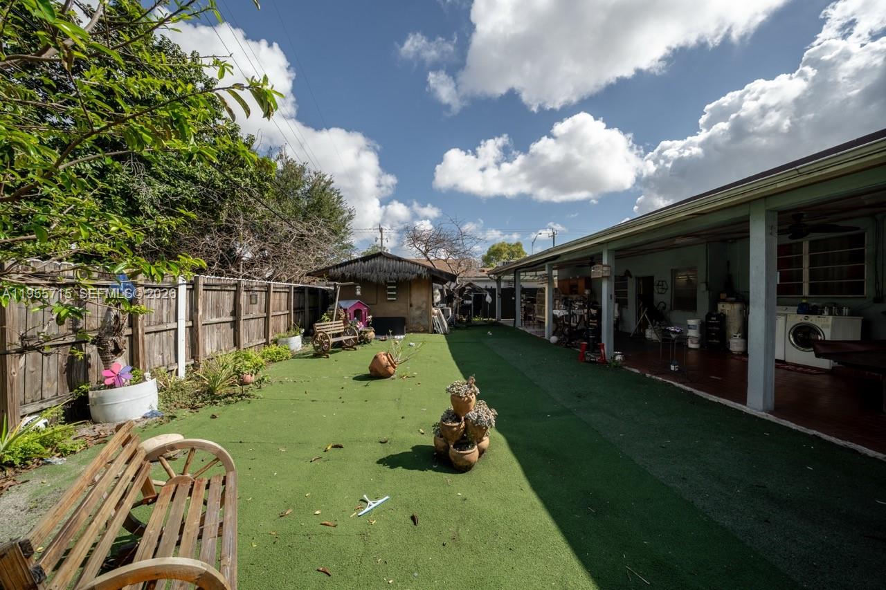 671 East 6th Place Hialeah, FL 33010 - Photo 32 of 40 a view of outdoor space yard deck patio and outdoor kitchen