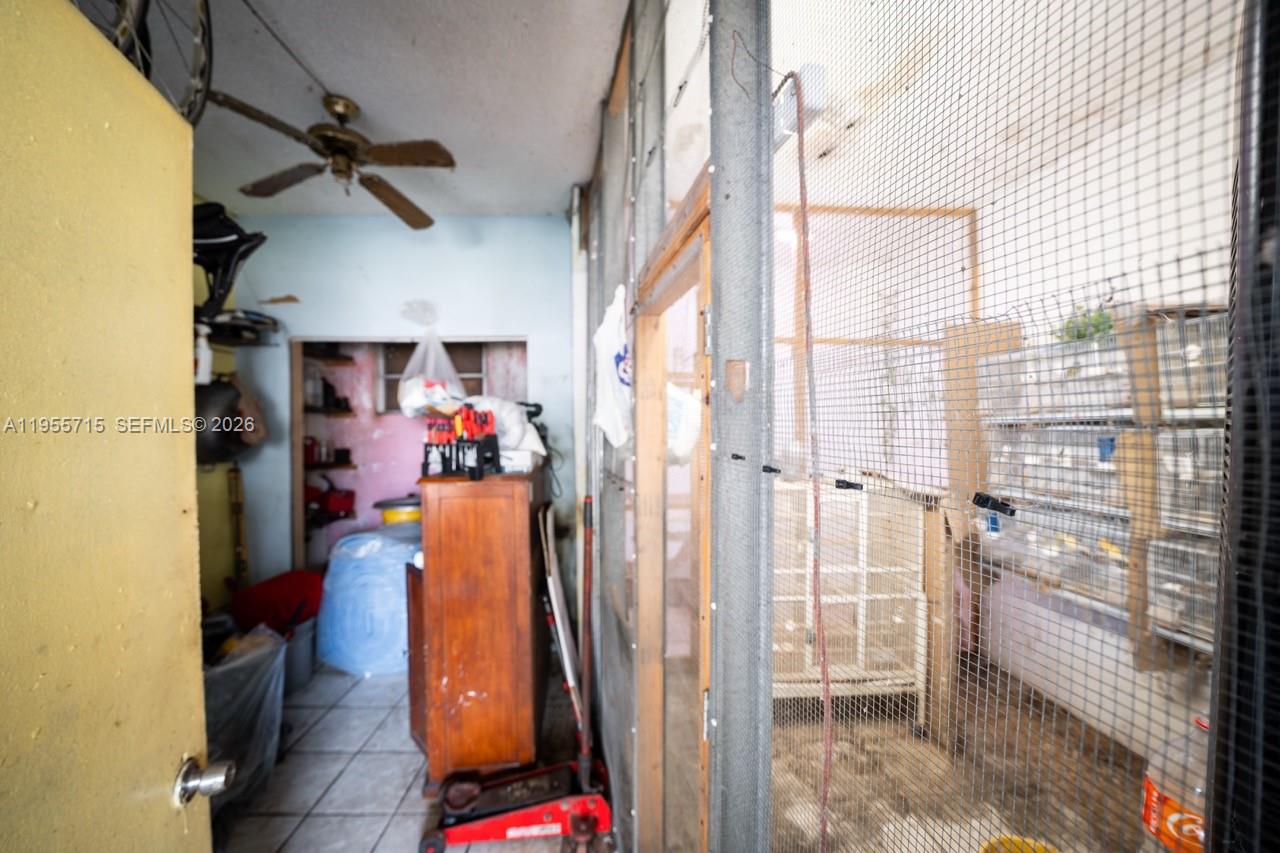 671 East 6th Place Hialeah, FL 33010 - Photo 34 of 40 a view of walk in closet with clothes and shoes