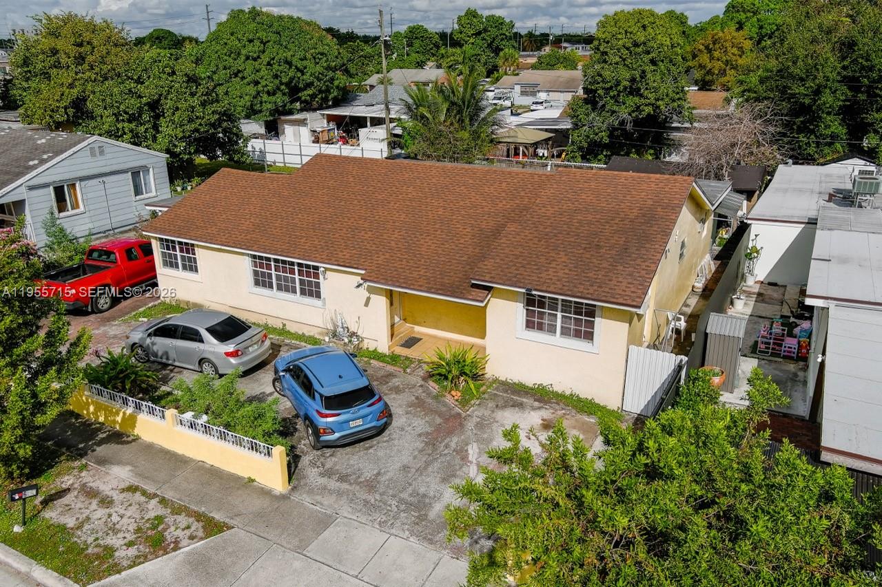 671 East 6th Place Hialeah, FL 33010 - Photo 37 of 40 an aerial view of a house with a yard
