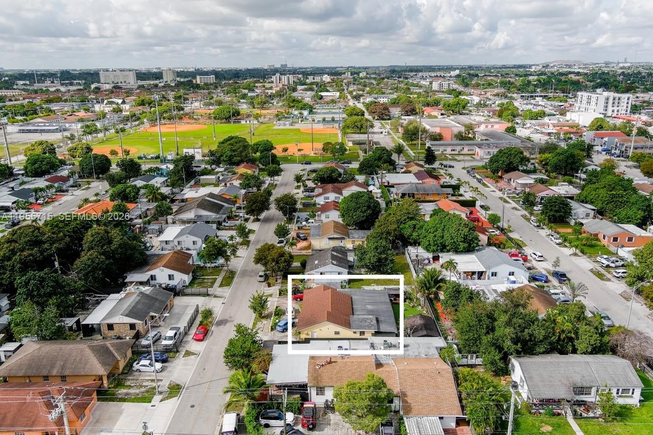 671 East 6th Place Hialeah, FL 33010 - Photo 40 of 40 an aerial view of residential houses with outdoor space