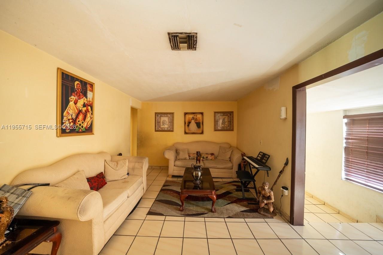 671 East 6th Place Hialeah, FL 33010 - Photo 8 of 40 a living room with furniture