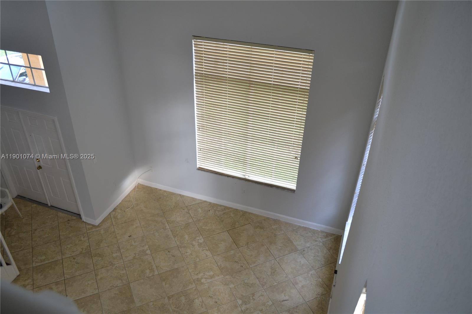 22418 Southwest 94th Path Cutler Bay, FL 33190 - Photo 20 of 71 a view of an empty room with a window