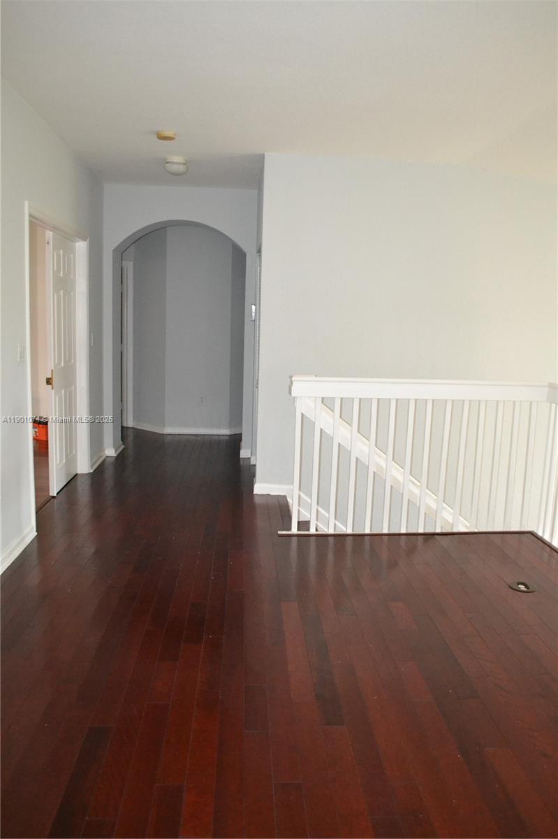 22418 Southwest 94th Path Cutler Bay, FL 33190 - Photo 22 of 71 a view of a hallway with wooden floor