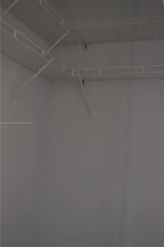 a sink with white cabinets
