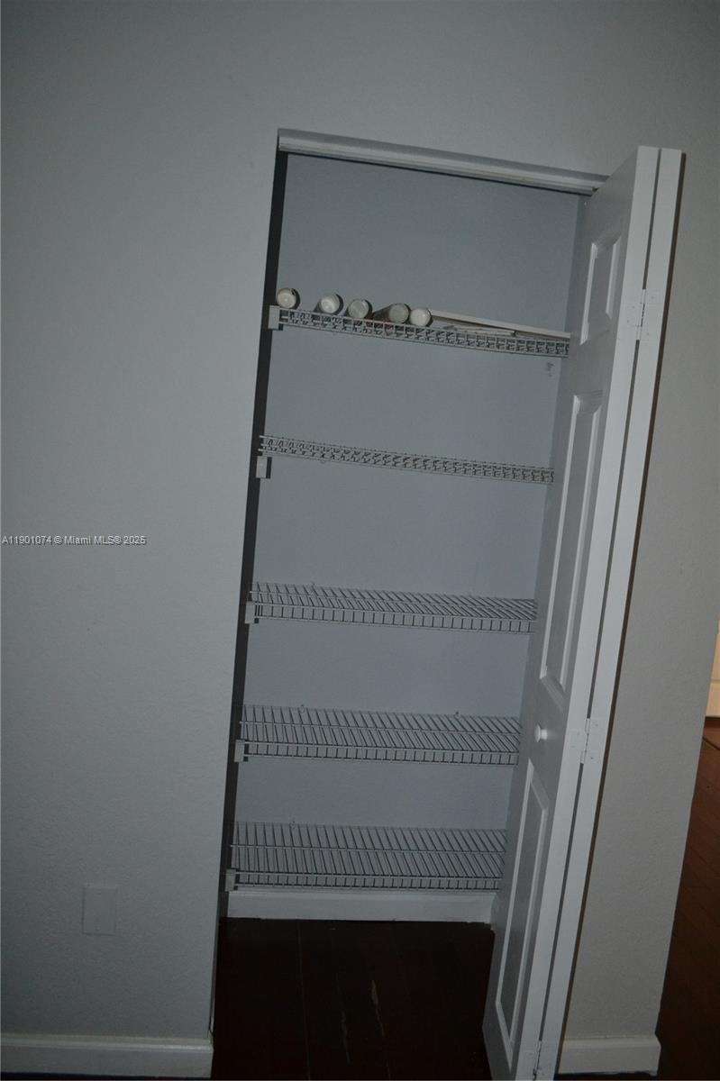 22418 Southwest 94th Path Cutler Bay, FL 33190 - Photo 36 of 71 a view of staircase with white walls and a window