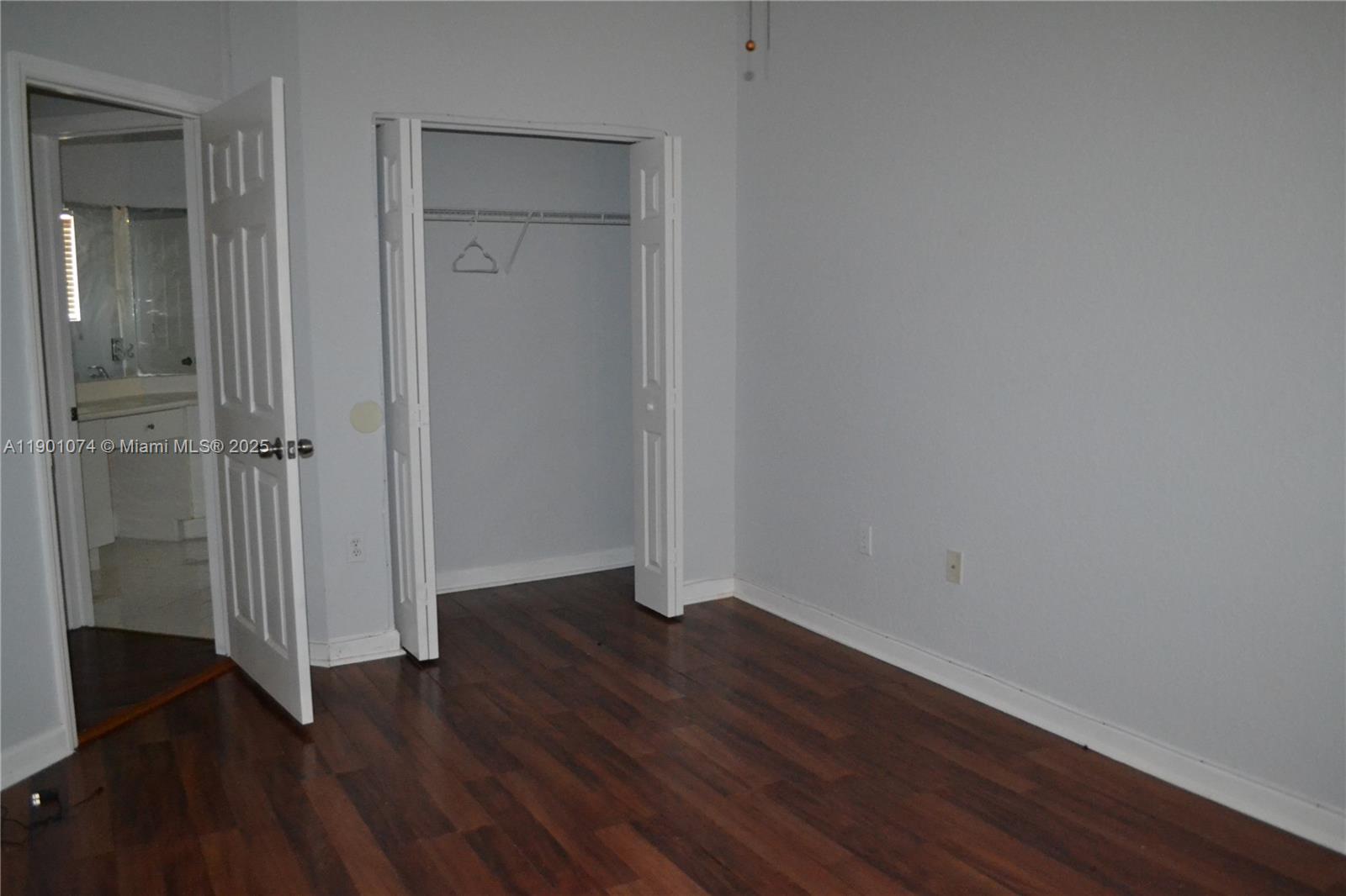 22418 Southwest 94th Path Cutler Bay, FL 33190 - Photo 37 of 71 an empty room with wooden floor & closet area