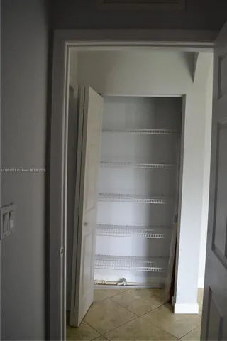 a utility room with closet dryer and washer