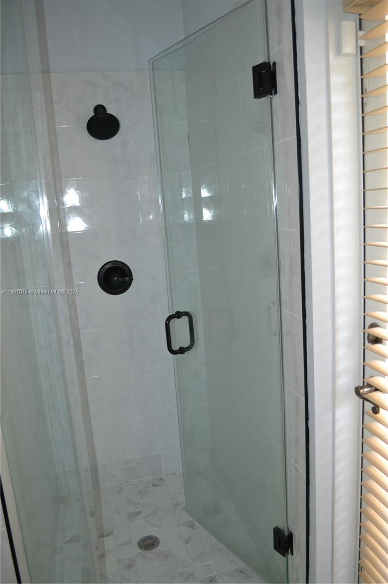 22418 Southwest 94th Path Cutler Bay, FL 33190 - Photo 43 of 71 Updated bathroom with standing shower on the first floor.