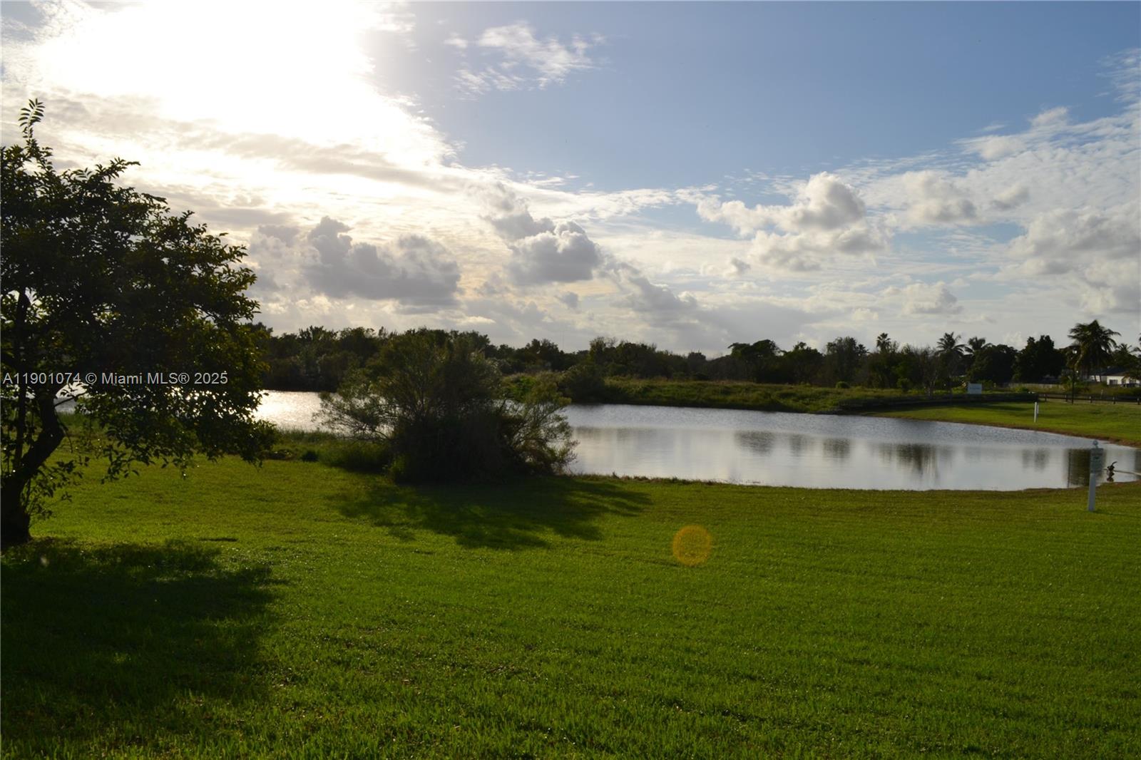 22418 Southwest 94th Path Cutler Bay, FL 33190 - Photo 52 of 71 a view of a lake with houses in the back