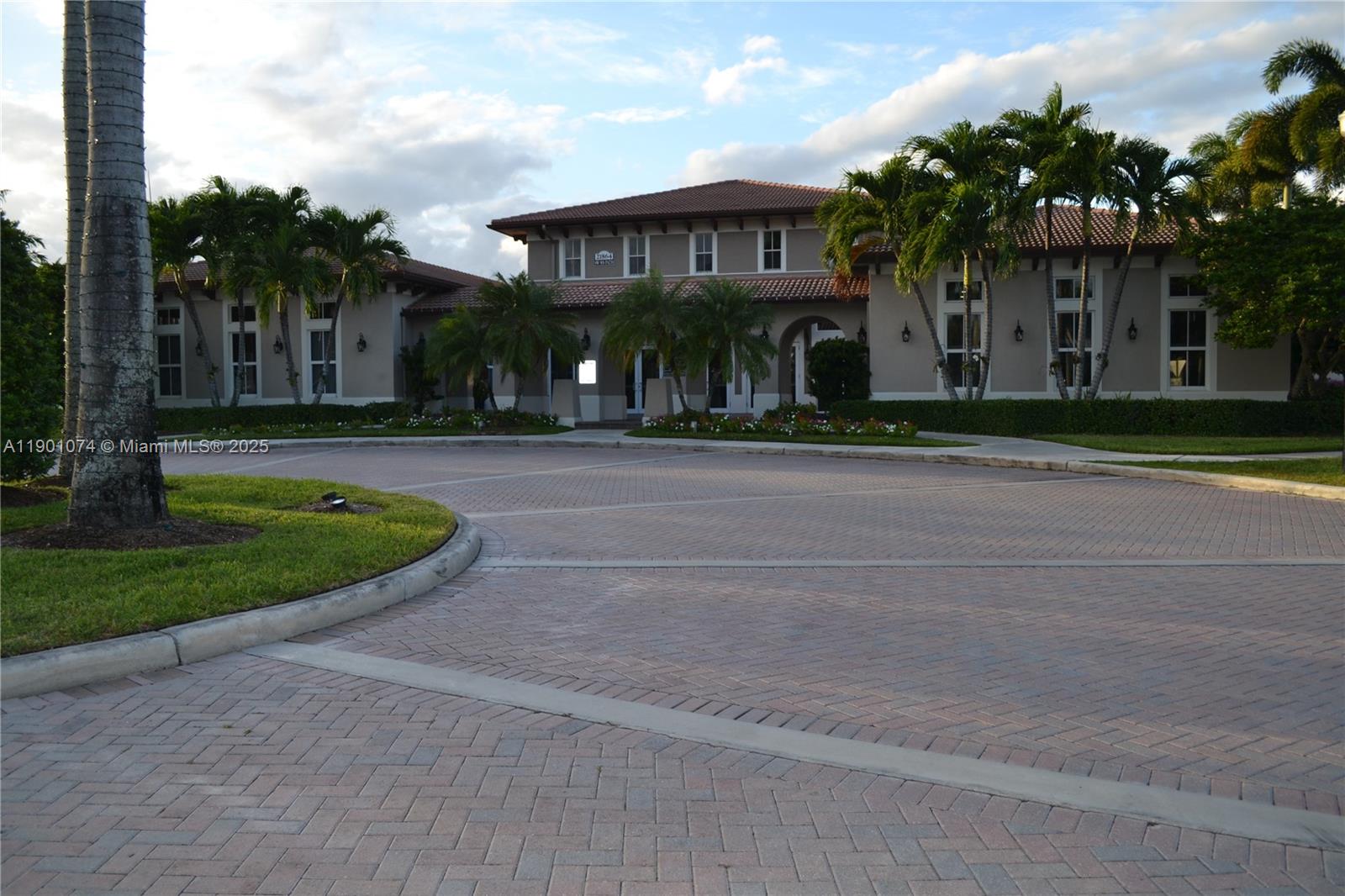 22418 Southwest 94th Path Cutler Bay, FL 33190 - Photo 59 of 71 front view of a house with a yard