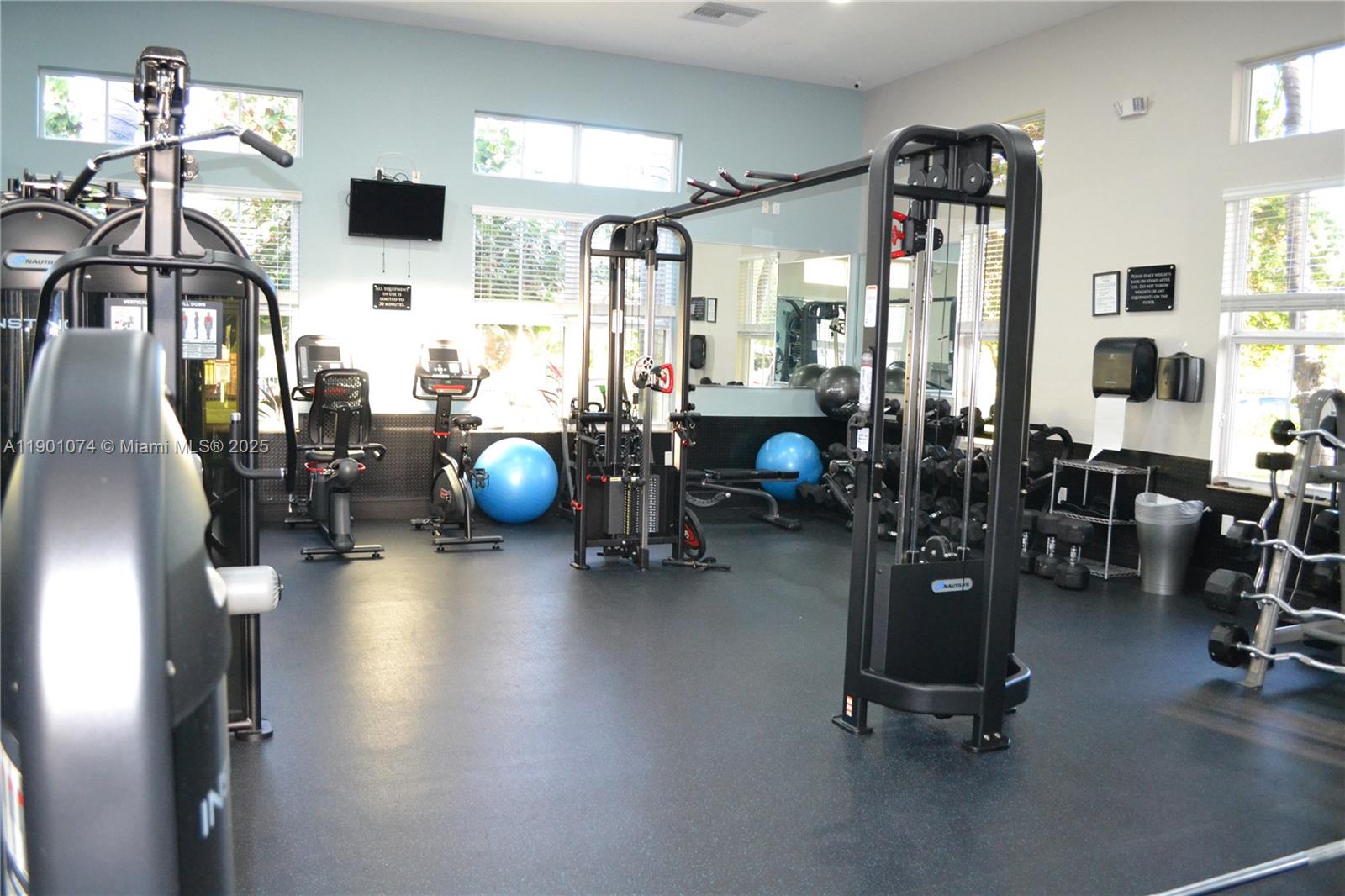 22418 Southwest 94th Path Cutler Bay, FL 33190 - Photo 68 of 71 a view of a room with gym equipment