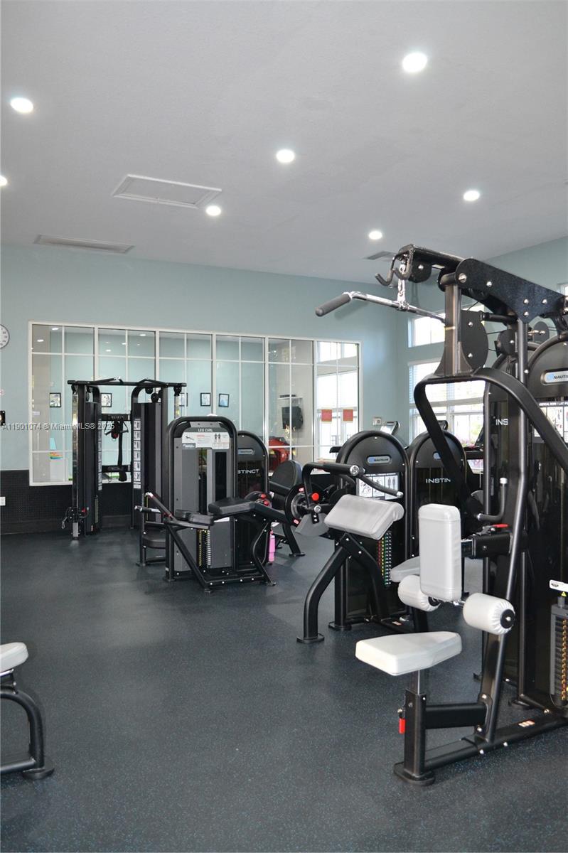 22418 Southwest 94th Path Cutler Bay, FL 33190 - Photo 69 of 71 a view of a room with gym equipment