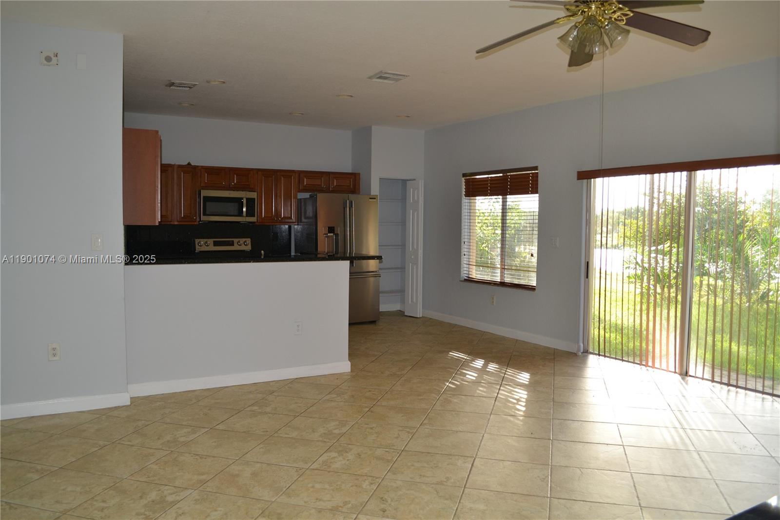 22418 Southwest 94th Path Cutler Bay, FL 33190 - Photo 7 of 71 View of the kitchen from the family room.