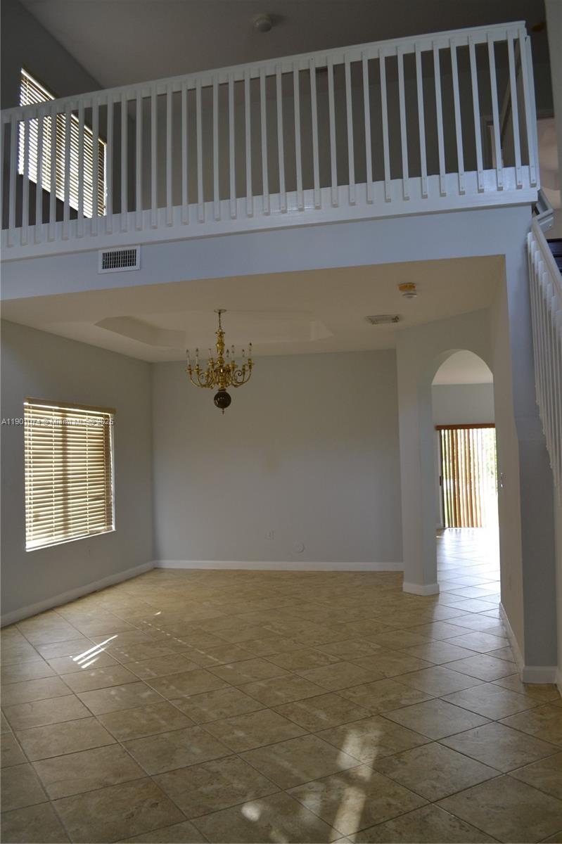 22418 Southwest 94th Path Cutler Bay, FL 33190 - Photo 8 of 71 a view of a room with wooden floor