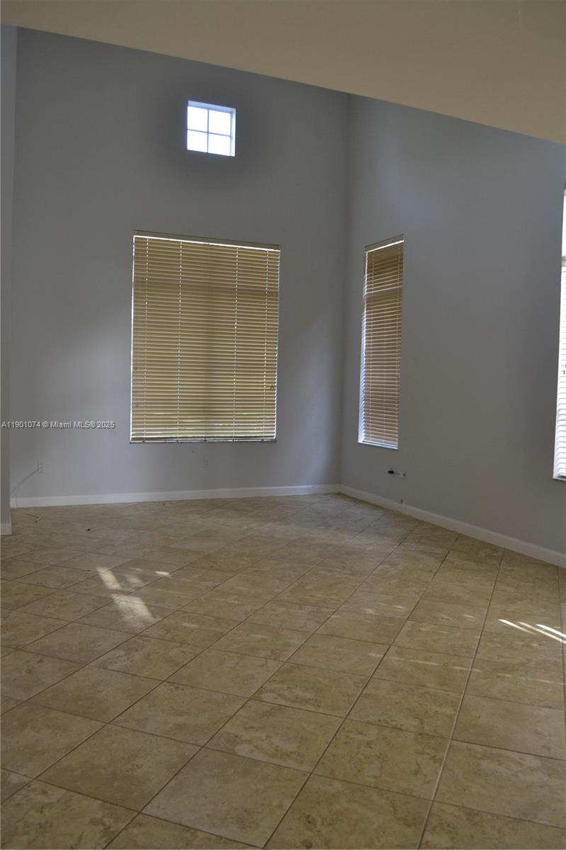 22418 Southwest 94th Path Cutler Bay, FL 33190 - Photo 10 of 71 a view of an empty room with a window