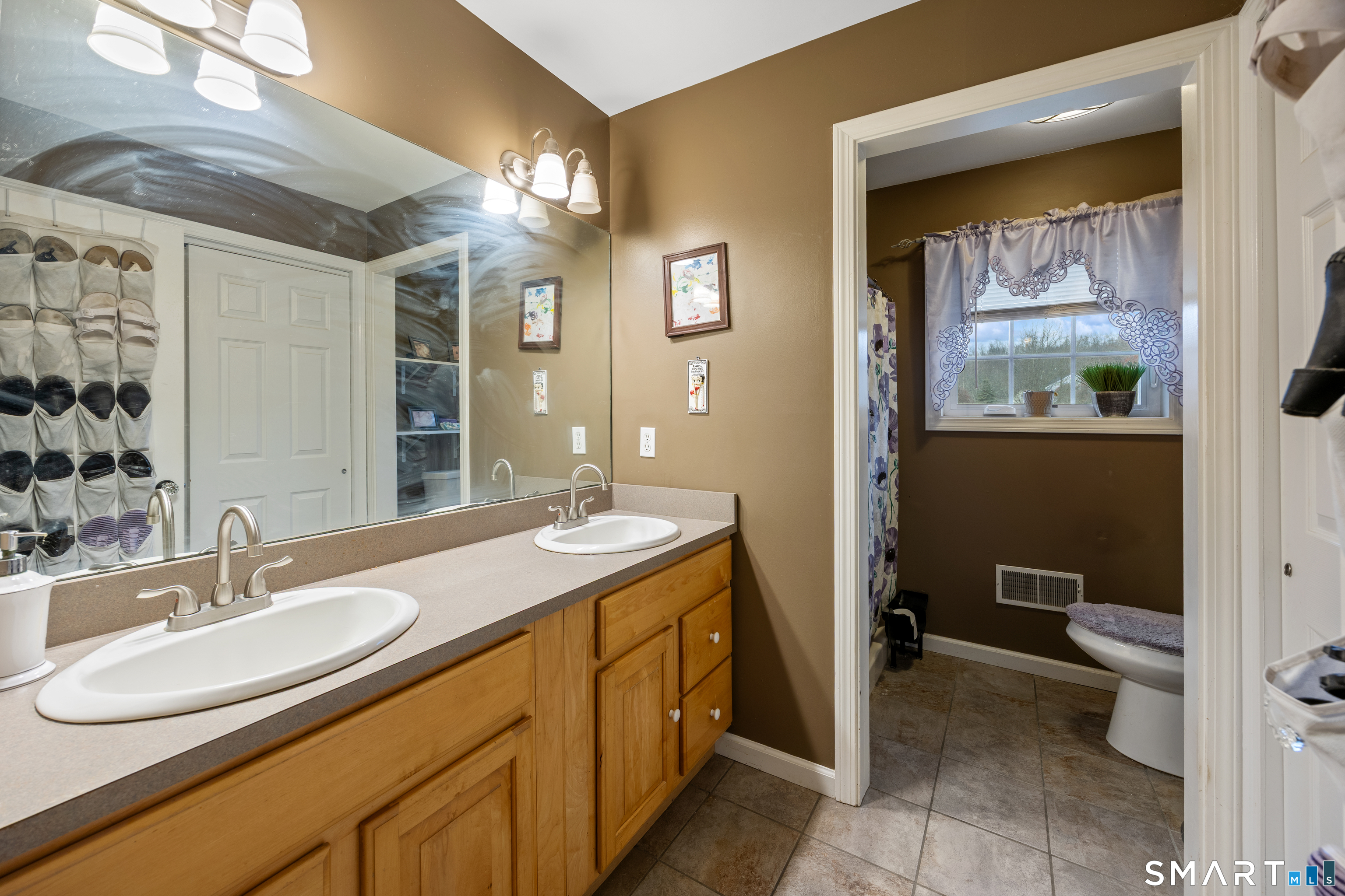 197 Preston Road Plymouth, CT 06786 - Photo 22 of 39 a bathroom with a sink a toilet and a mirror