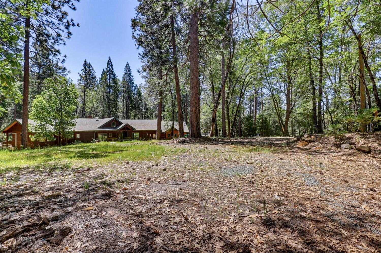 14517 North Bloomfield Road Nevada City, CA 95959 - Photo 51 of 78 a view of a house with a yard and tree s