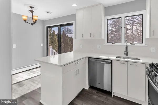 a kitchen with a sink and large window