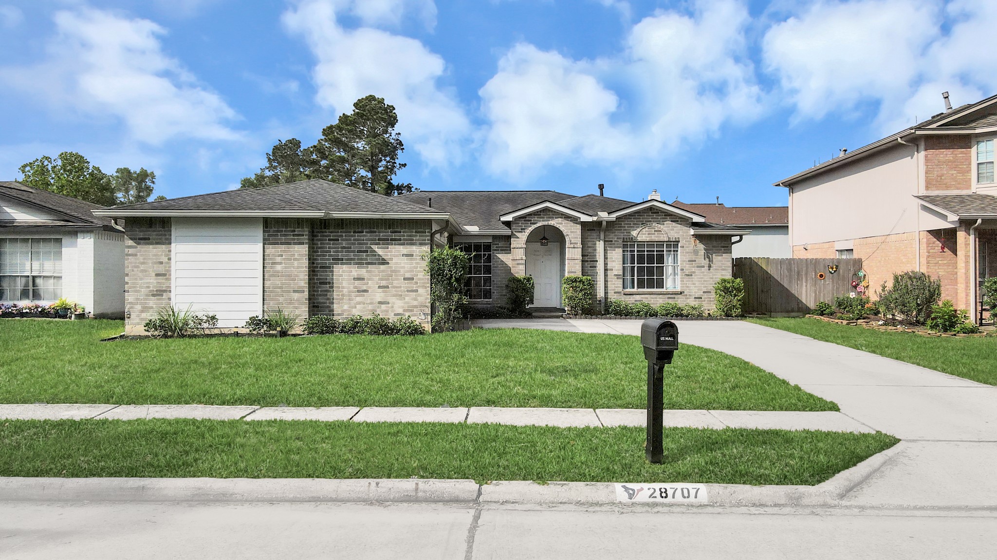 28707 Stapleford Street Spring, TX 77386 - Photo 2 of 38 a front view of a house with a yard