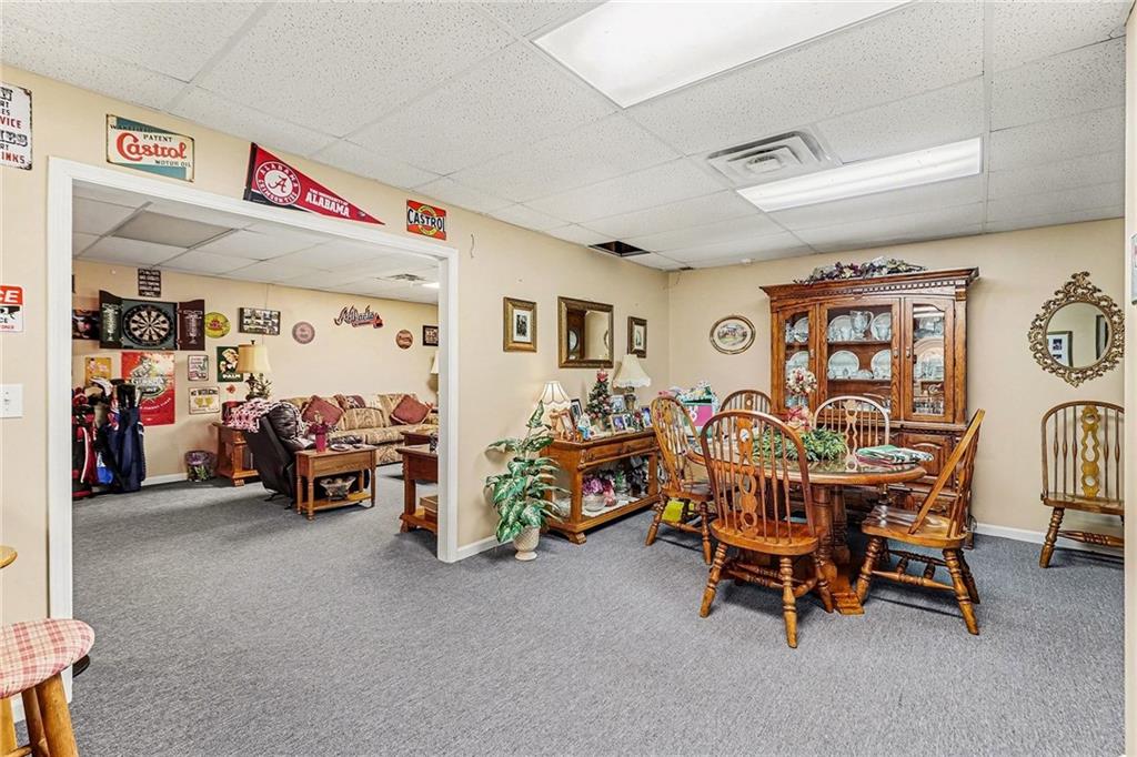 7537 Berea Road Winston, GA 30187 - Photo 11 of 37 a living room with lots of furniture and a fan