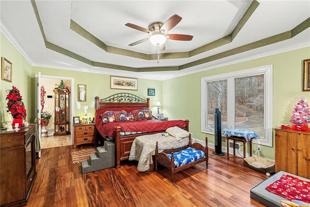 7537 Berea Road Winston, GA 30187 - Photo 11 of 34 a bedroom with a bed and wooden floor