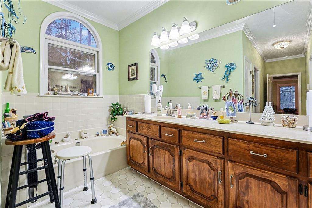 7537 Berea Road Winston, GA 30187 - Photo 12 of 34 a bathroom with a double vanity sink and a mirror