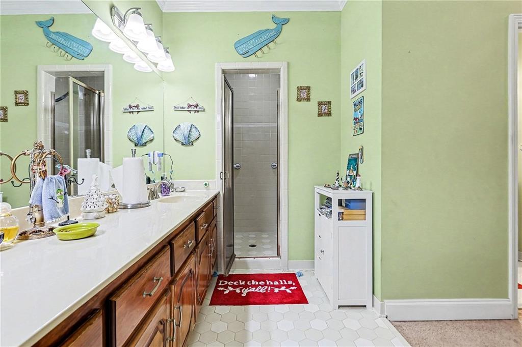 7537 Berea Road Winston, GA 30187 - Photo 13 of 34 a bathroom with a sink a mirror and a shower