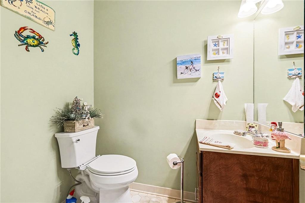 7537 Berea Road Winston, GA 30187 - Photo 14 of 34 a bathroom with a sink mirror vanity and toilet