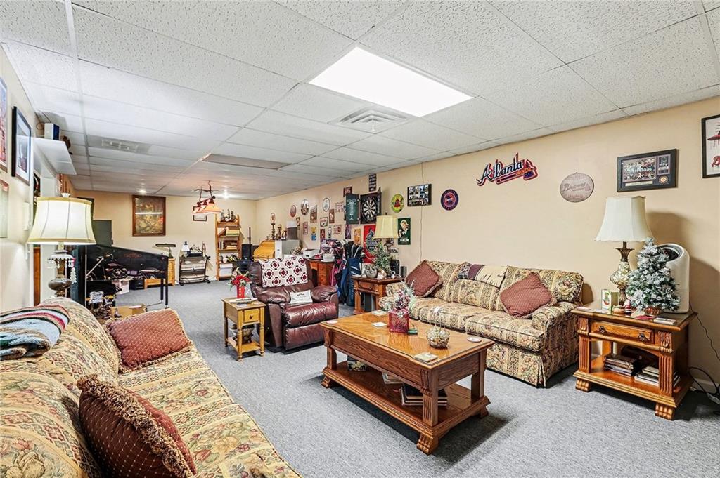 7537 Berea Road Winston, GA 30187 - Photo 17 of 37 a living room with furniture and a flat screen tv