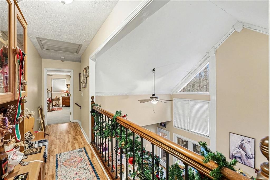 7537 Berea Road Winston, GA 30187 - Photo 24 of 37 a view of a hallway with wooden floor and staircase